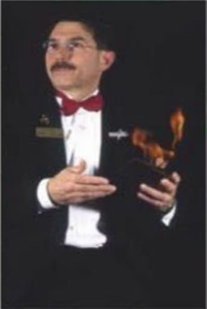 A surprising flash of fire during Ken Caplan's magic performance