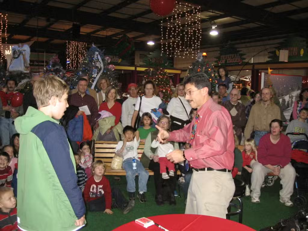 Children and adults enjoying Ken Caplan's family magic show
